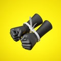 3d render, black human hands fists tied with plastic zip ties, isolated on yellow background.