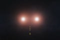 3D car headlights on a foggy road at night