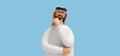 3d render, cartoon character arab man with beard wears traditional white clothes and looks at camera. Thinking pose. Business clip