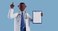 3d render, cartoon character doctor with dark skin, wears glasses, shows finger up, holds clipboard with blank paper. Medical Royalty Free Stock Photo