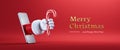 3d render. Cartoon character Santa Claus hand holds candy cane, sticking out the mobile phone screen. Merry Christmas banner with Royalty Free Stock Photo