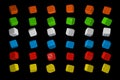 3d render Casino Dice Set . Red, Yellow, Green, Blue and White Poker Cubes Isolated on black Background