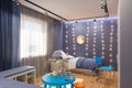 3d render of the children`s bedroom interior in deep blue color. Royalty Free Stock Photo