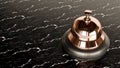 chrome Reception bell isolated on black marbel background, hotel bell Royalty Free Stock Photo