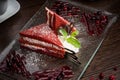 Beautifully served red-white cake on a glass plate with a berry Royalty Free Stock Photo