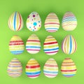 3d render of 12 colorful easter eggs on green background