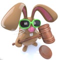 3d Cute chocolate Easter bunny rabbit holding an auctioneers gavel