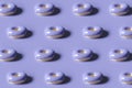 3d render of donut pattern glazed with violet color of the year 2022