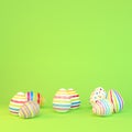 3d render - eight colorfu Easter eggs on green background