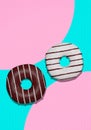 3d render fashion collage flat lay scene..Chocolate glaze black and white donuts on pink and blue vanilla background. Donut lover