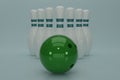 3d render green bowling ball crashing into the pins on light green background. Concept of success and win. 3D rendering Royalty Free Stock Photo