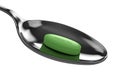 3d render of green tea pill on spoon Royalty Free Stock Photo