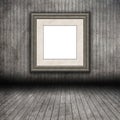 3D grunge wooden room interior with blank picture frame Royalty Free Stock Photo