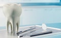 3D render of human tooth and dental equipment in consulting room Royalty Free Stock Photo