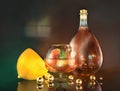 3d render illustration of lemon lime half cognac glass bottle and gold balls art still life in dark room Royalty Free Stock Photo