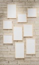 3D render illustration of multi size blank photo frames on the sand block bright wall. Empty picture frame mockup Royalty Free Stock Photo