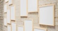 3D render illustration of multi size blank photo frames on the sand block bright wall. Empty picture frame mockup. View from side Royalty Free Stock Photo
