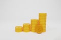 Stack of golden coins on white background. Royalty Free Stock Photo