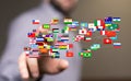 3d render of International Business World Flags Globe in hand with a male blurred in the background Royalty Free Stock Photo