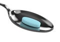 3d render of magnesium pill on spoon