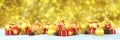 3d render - golden and red christmas baubles over bokeh background - panorama Royalty Free Stock Photo