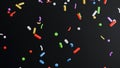 3d render of many multicolored confetti on black background Royalty Free Stock Photo