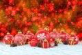 3d render - red christmas baubles over bokeh background Royalty Free Stock Photo