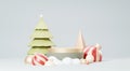 3d Render Merry Christmas Podium platforms scene decorate with christmas tree, gifts, ball and snowflakes in winter season theme.