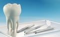 3D render of oversize human tooth and dental tools on silver tray