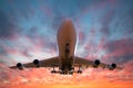 Airplane on take off at sunset