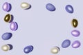 3d render of pastel colored Easter eggs frame on a violet color of the year 2022 background Royalty Free Stock Photo