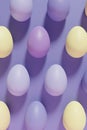3d render of pastel colored violet, purple and yellow Easter eggs pattern on a violet background Royalty Free Stock Photo