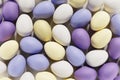 3d render of pastel colored violet, purple and yellow Easter eggs on a white background Royalty Free Stock Photo
