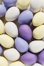 3d render of pastel colored violet, purple and yellow Easter eggs on a white background Royalty Free Stock Photo