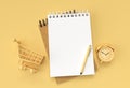 3D Render Pen and Notepad with Alram Clock and Shopping Cart on the Pastel Color Background Royalty Free Stock Photo