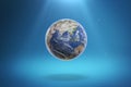 3D Render Planet Earth with Light Rays on Gradient Blue Background. Royalty Free Stock Photo