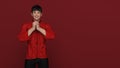 3D Render : Portrait of young Asian man in traditional Cheongsam chinese dress with gesture of congratulation on chinese new year Royalty Free Stock Photo