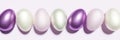 3d render of purple and pink colored Easter eggs on a pastel pink background Royalty Free Stock Photo