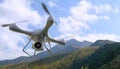3d render quadrocopters mountains in the background. Radio-controlled drone is filming nature. Unmanned flying toys Royalty Free Stock Photo