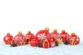 3d render - red christmas baubles over white background Royalty Free Stock Photo