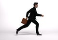 3D render : a running man  in casual business suit with a briefcase in his hand Royalty Free Stock Photo