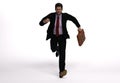 3D render : a running man  in casual business suit with a briefcase in his hand Royalty Free Stock Photo