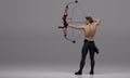 3D Render : a shirtless young male archer pose practicing archery in the studio Royalty Free Stock Photo