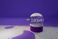 3d render of snowglobe and snow on purple background with 2024 numerals Royalty Free Stock Photo