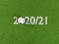 Soccer ball within the dates 2020/2021. Concept for the soccer / football season 2020/2021