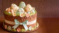 Soft Color Eggs With Flowers Decorative Cake And Fondant Ribbon Against Brown Texture Background. Happy Easter Day