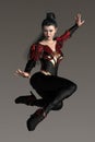 3D render of strong fantasy style woman leaping into the air in a magical style pose