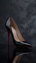 3D Render of a Stylish Black High Heel Shoe with Red Sole and Reflection Royalty Free Stock Photo