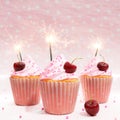 3D render of thee cherry flavoured cupcakes with fire sparks