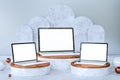 3D render. Three laptops with blank white screen on podiums. Royalty Free Stock Photo